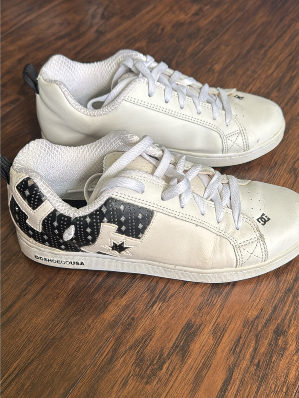 DC women’s White Sneakers with Black Logo Detail